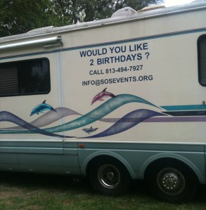 Side view of motor home: Would you like two birthdays?